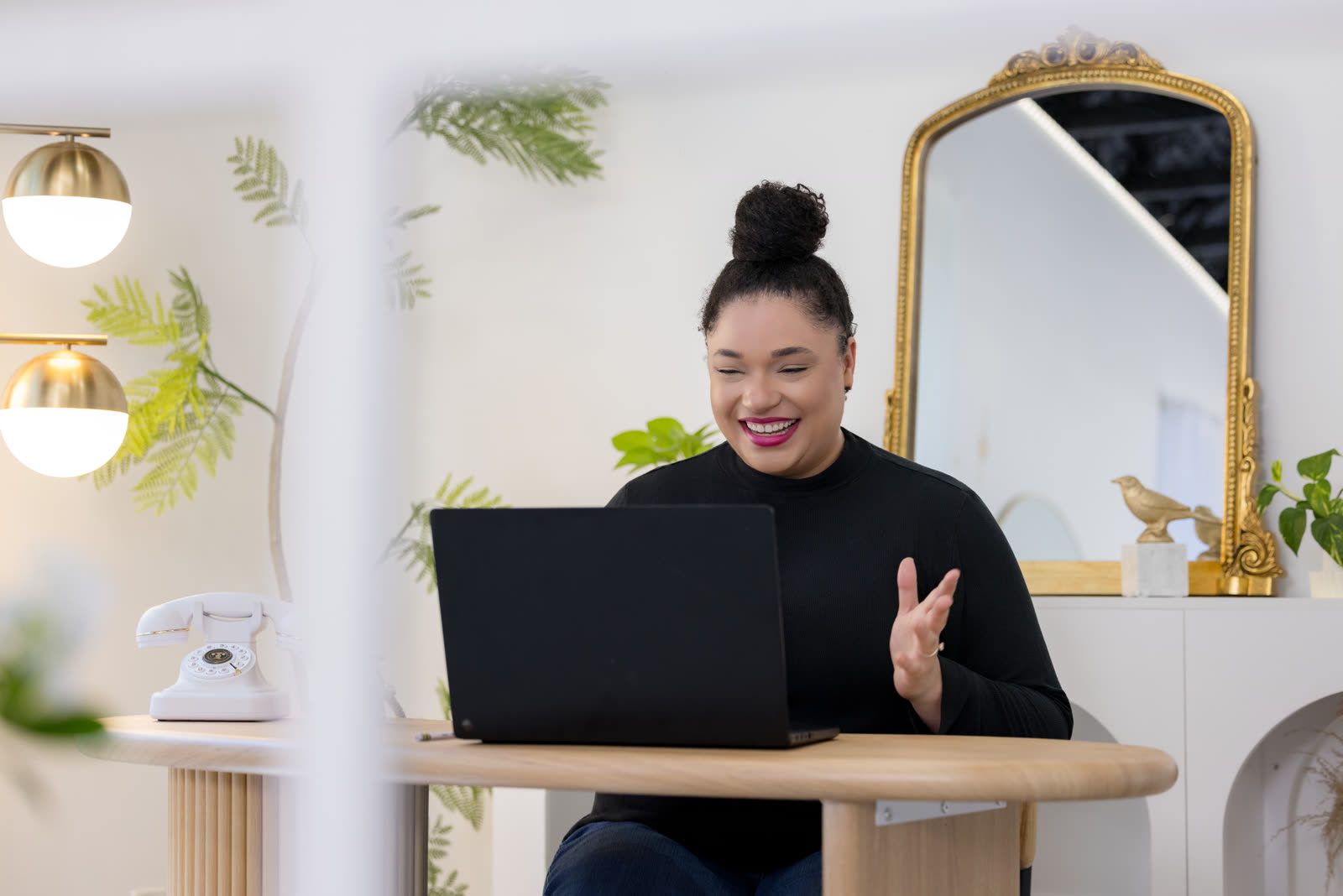 Jillian waving from her desk